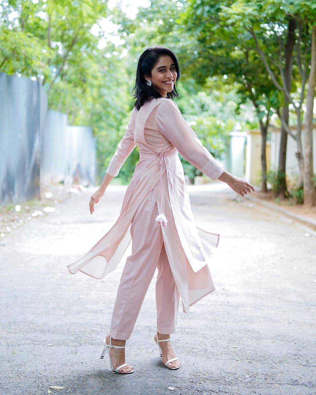 The double layered kurtha with a side-tie is the creme of the 'adoptable-pastels' we've seen this season, so is the cut of the pants  - Fashion Models