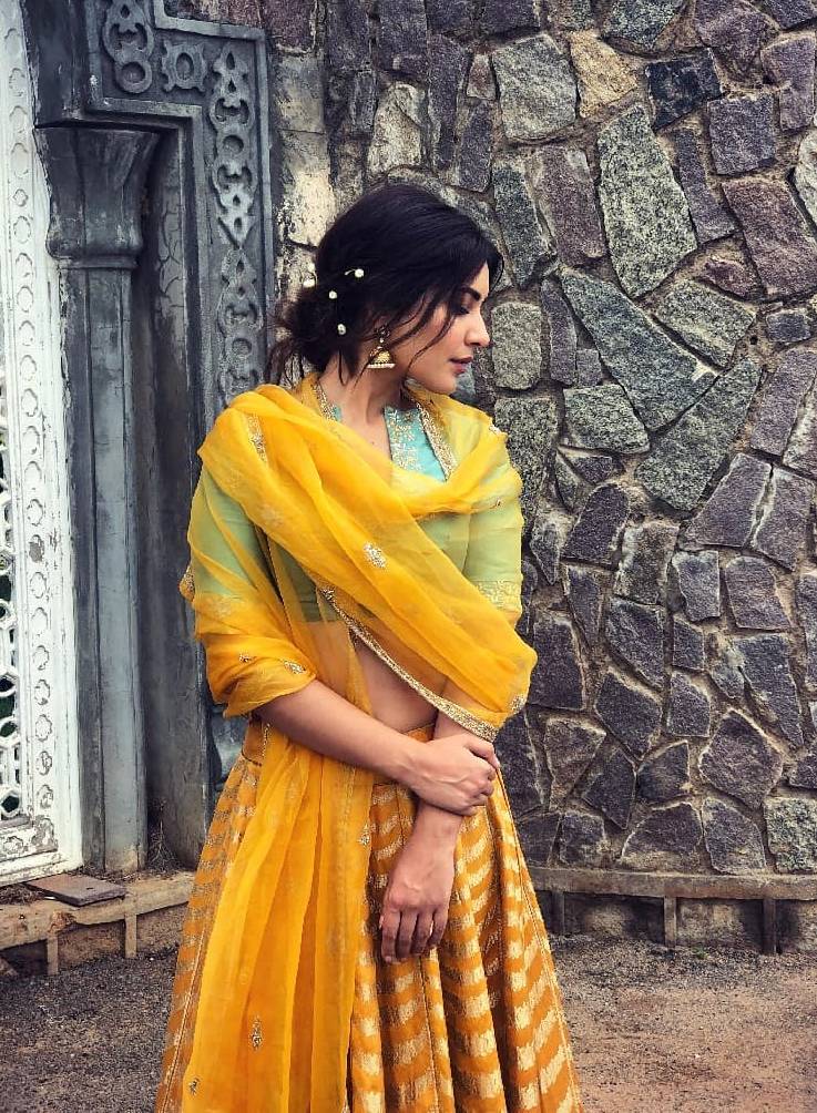 Raashi Khanna was recently clicked in an intrcate bright yellow lehenga ensemble from Sailesh Singhania that exudes  - Fashion Models