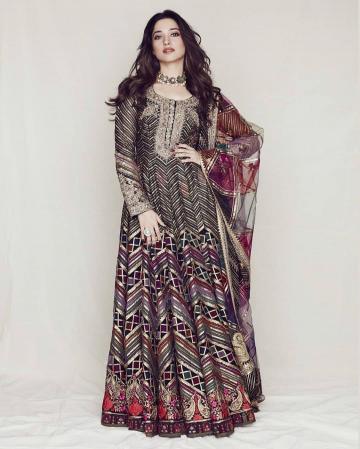 The bottom kalidar has an assortment of ribbons down sown down the skirt and finishes in a flowery pattern sprinkled with resham and zardosi - Fashion Models