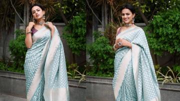  Shraddha Srinath being the lady of the manor in this detailed turquoise saree