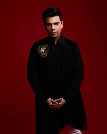 We love Karan's penchant for bling on his clothes - we're always seeing clothing jewellery or bling designs like this sparkling lion emblem here - Fashion Models