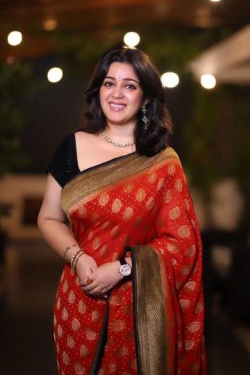 Charmme Kaur was recently spotted in a crimson red georgette Benarasi saree from Sailesh Singhania with a becoming black-gold antique zari border - Fashion Models