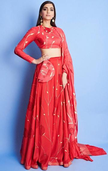 The lehenga from Vedika M has embroidery detailing and uniquely cut close-neck blouse; We're loving that they even added  a clutch in the same material! - Fashion Models