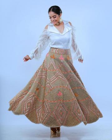 The mirror work lehenga is in beautiful colour; the cold shoulder top has an interesting crunched puff sleeve - Fashion Models