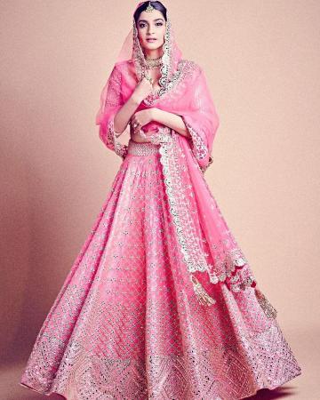The hand embroidered lehenga has mirror work scattered through it - Fashion Models