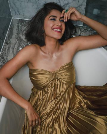 TV sweetheart Mrunal Thakur went to the Gold awards night in a beautiful gold off-shoulder gown from Zwaan - Fashion Models