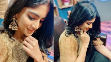 Gorgeous Megha Akash in black and gold