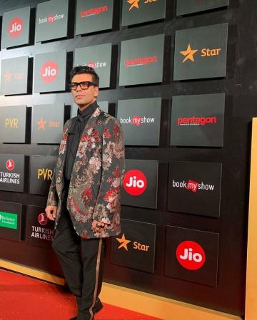 Karan arrived for the Mumbai Film Festival in this colourful suit from Comme des Garcons - Fashion Models