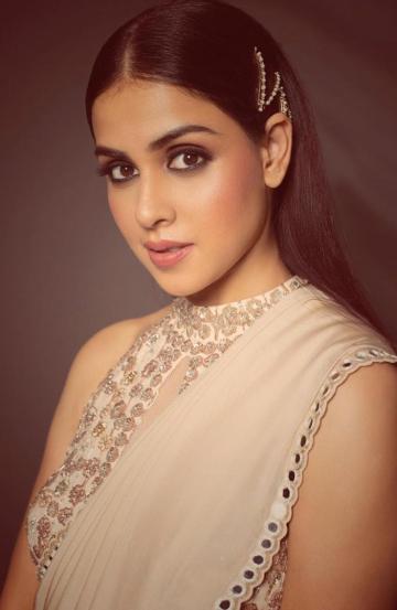 Genelia's make-up is also on point, with accentuated eyes and a subtle blusher that matches the lip colour - Fashion Models