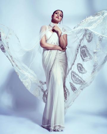 The embroidered cape is the most attractive feature of this sequin-bordered saree ensemble - Fashion Models