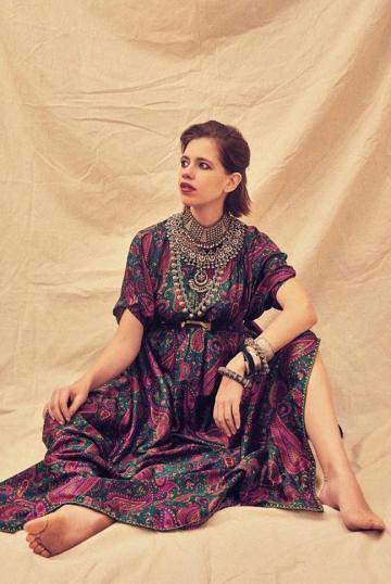 The kaftan is cinched above Kalki's advancing belly using a belt, nearly hiding it - Fashion Models