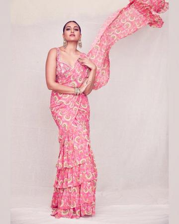 The floral pink saree has charming layers and a ruffled pallu - Fashion Models