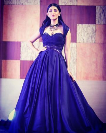 We love the sleeve of the gown which forms an arch around Shruthi's shoulders and the belts at the waist - Fashion Models