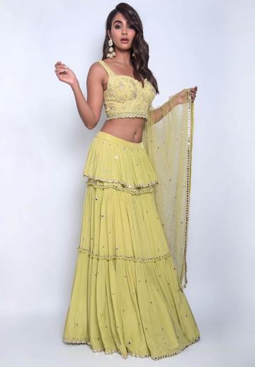 The tiered skirt has mirrors on them and the shawl has matching adornments - Fashion Models