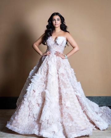 The lady is wearing a light pink, floral lace gown with beadings and 3D organza from the spring-summer 2020 collection of label Nedret Taciroglu - Fashion Models