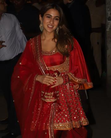 Sara Ali Khan arrived for the Diwali celebrations at Amitabh Bachchan's residence in this lustrous red Anarkali from designers Abu Jani and Sandeep Khosla - Fashion Models