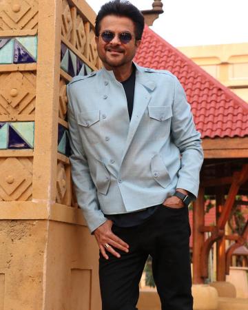 Mr. India, who is busy with the promotion of the movie Pagalpanti, paired it with a black tee and black pants, making the ensemble action-ready - Fashion Models
