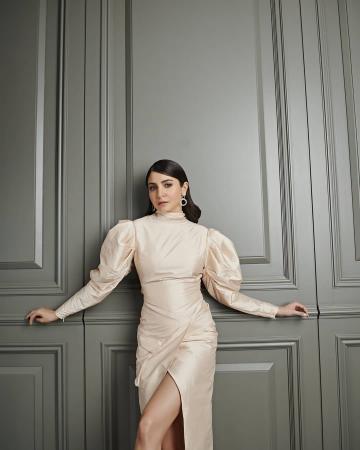 Stylist Allia Al Rufai seems to have impressed many by curating this high-necked gown which has a fabulous Leg O'Mutton sleeve and a cool cross-over hemline - Fashion Models