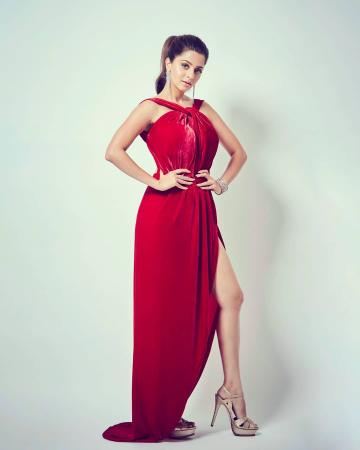 The velvet number has a tie halter neckline, a slit on the thigh and is backless - Fashion Models