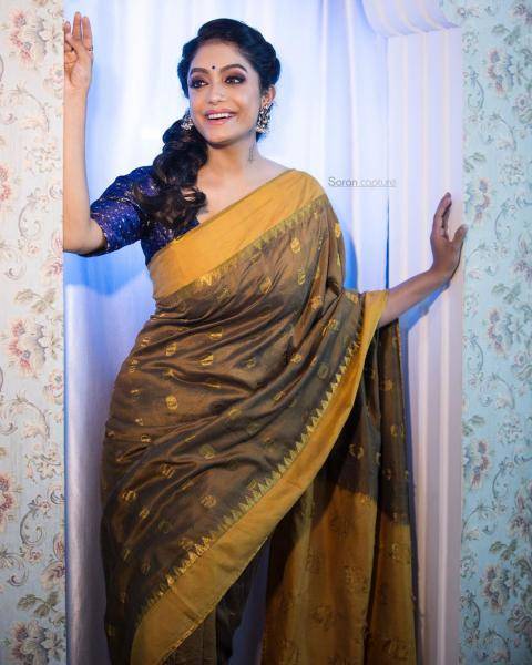 The mustard coloured saree is complemented well by the blue blouse - Fashion Models