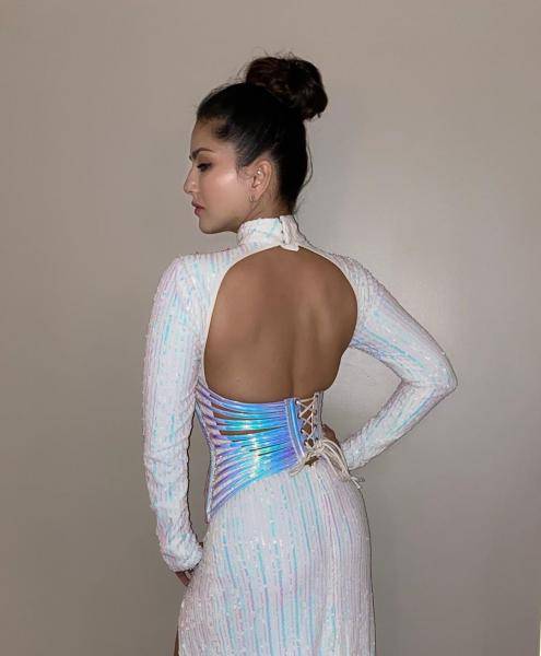 We love the cut-out back, and the high bun suits the look well - Fashion Models